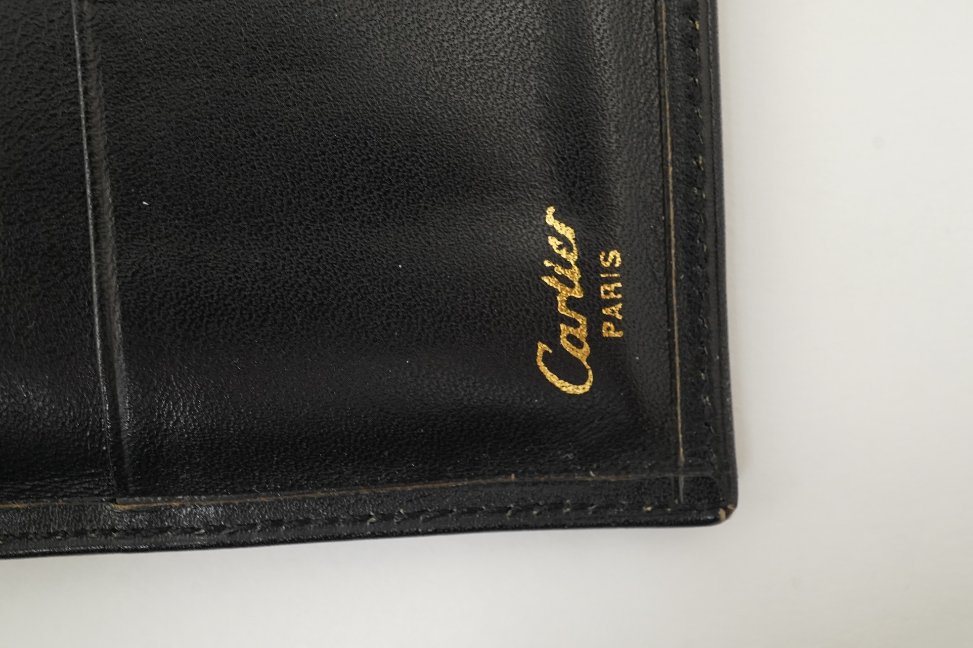 A gentleman's black Cartier wallet